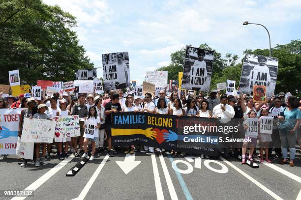 Actor Lin-Manuel Miranda and volunteers march during Families Belong Together Rally In Washington DC Sponsored By MoveOn, National Domestic Workers...