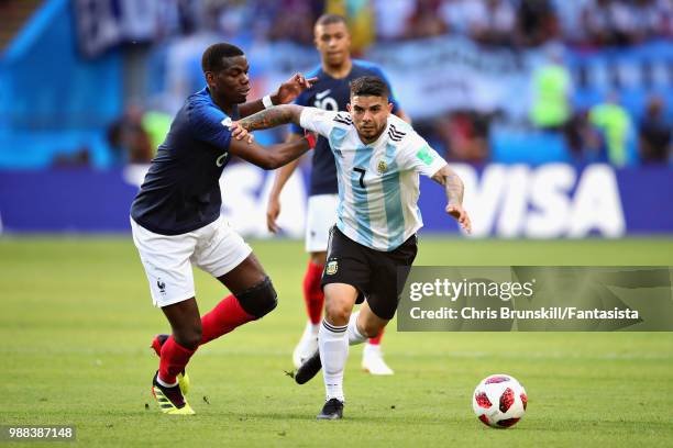 Ever Banega of Argentina is challenged by Paul Pogba of France during the 2018 FIFA World Cup Russia Round of 16 match between France and Argentina...