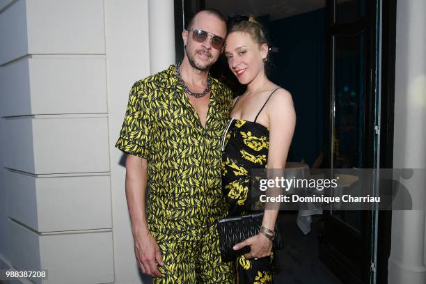 Chloe Sevigny and a guest attend Miu Miu 2019 Cruise Collection Party at Hotel Regina on June 30, 2018 in Paris, France.