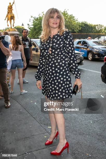 Actress Emmanuelle Seigner attends the Miu Miu 2019 Cruise Collection Show at Hotel Regina on June 30, 2018 in Paris, France.