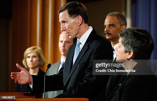 Deputy Director of the FBI John S. Pistole speaks at a press conference held by U.S. Attorney General Eric Holder at Department of Justice...