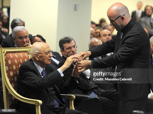 Italian President Giorgio Napolitano looks at pieces of new technology during the visit at IIT Italian Institute of Technology on May 4, 2010 in...