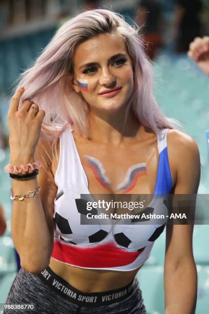 Female fan of Russia looks on at the end of the 2018 FIFA World Cup Russia Round of 16 match between Uruguay and Portugal at Fisht Stadium on June...