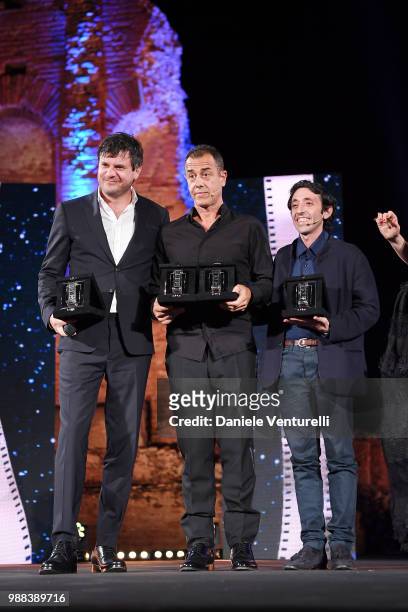 Marcello Fonte, Matteo Garrone and Edoardo Pesce are awarded during the Nastri D'Argento Award Ceremony on June 30, 2018 in Taormina, Italy.