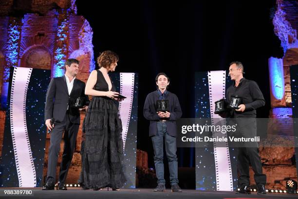 Edoardo Pesce, Carlotta Proietti, Marcello Fonte and Matteo Garrone are awarded during the Nastri D'Argento Award Ceremony on June 30, 2018 in...