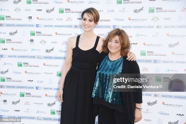 Paola Cortellesi and Laura Delli Colli attend the Nastri D'Argento cocktail party on June 30, 2018 in Taormina, Italy.