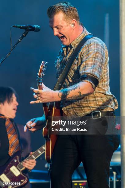 Josh Homme of Queens of the Stone Age performs live on stage at Finsbury Park on June 30, 2018 in London, England.