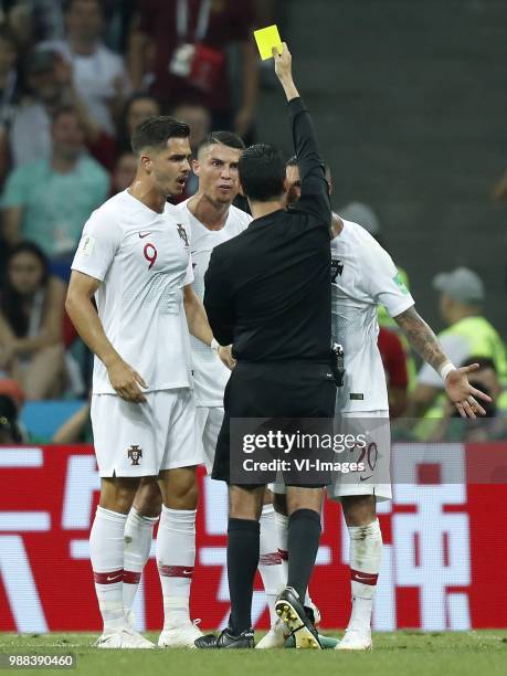 Andre Silva of Portugal, Cristiano Ronaldo of Portugal, referee Cesar Ramos, Ricardo Quaresma of Portugal during the 2018 FIFA World Cup Russia round...