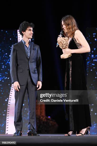 Luigi Fedele, is awarded by Kasia Smutniak, during the Nastri D'Argento Award Ceremony on June 30, 2018 in Taormina, Italy.