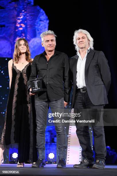 Kasia Smutniak, Luciano Ligabue and Domenico Procacci are awarded during the Nastri D'Argento Award Ceremony on June 30, 2018 in Taormina, Italy.