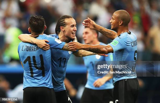 Diego Laxalt of Uruguay celebrates with team mates at full time during the 2018 FIFA World Cup Russia Round of 16 match between Uruguay and Portugal...