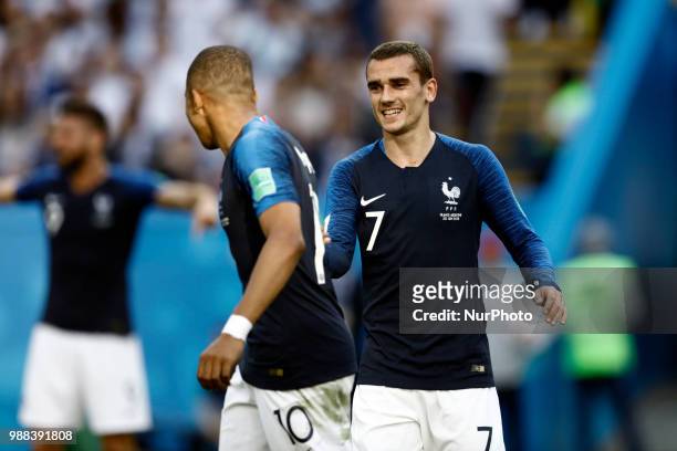 Kylian Mbappe of France team and his teammate Antoine Griezmann celebrate after scoring the teams fourth goal in the second half during the match of...