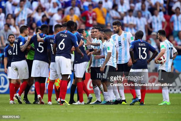 Referee Alireza Faghani tries to calm the teams down during the 2018 FIFA World Cup Russia Round of 16 match between France and Argentina at Kazan...
