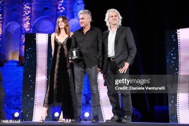 Kasia Smutniak, Luciano Ligabue and Domenico Procacci are awarded during the Nastri D'Argento Award Ceremony on June 30, 2018 in Taormina, Italy.