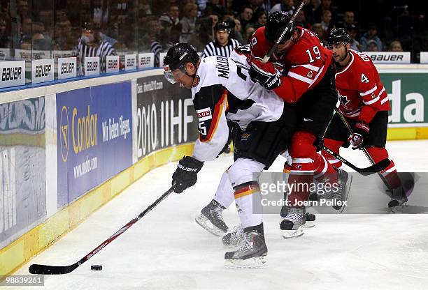 Steven Stamkos of Canada challenges Marcel Mueller of Germany during the pre IIHF World Championship match between Germany and Canada at the O2 World...