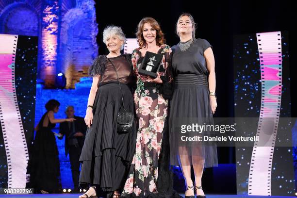 Erminia Ferrari Manfredi, Claudia Gerini and a guest are awarded during the Nastri D'Argento Award Ceremony on June 30, 2018 in Taormina, Italy.