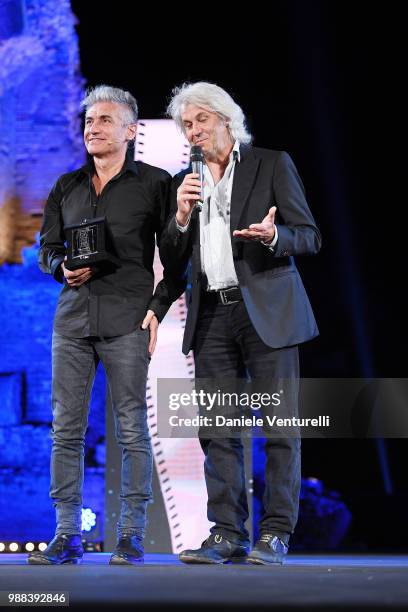 Luciano Ligabue and Domenico Procacci are awarded during the Nastri D'Argento Award Ceremony on June 30, 2018 in Taormina, Italy.