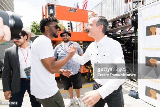 Actor Chadwick Boseman and mayor Eric Garcetti attend 'Families Belong Together - Freedom for Immigrants March Los Angeles' at Los Angeles City Hall...