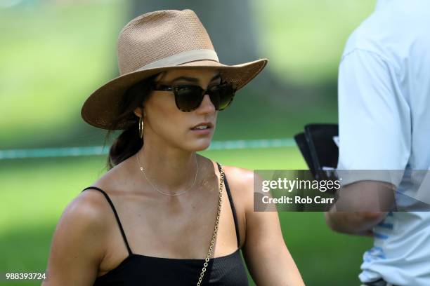 Allison Stokke, fiance of Rickie Fowler, looks on during the third round of the Quicken Loans National at TPC Potomac on June 30, 2018 in Potomac,...