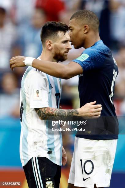 Lionel Messi of Argentina and Kylian Mbappe of France embrace after the 2018 FIFA World Cup Russia Round of 16 match between France and Argentina at...