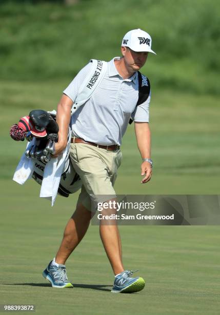 Billy Horschel's caddie walks with no bib during the third round of the Quicken Loans National at TPC Potomac on June 30, 2018 in Potomac, Maryland.