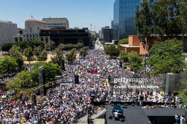 Musician John Legend performs onstage at 'Families Belong Together - Freedom for Immigrants March Los Angeles' at Los Angeles City Hall on June 30,...