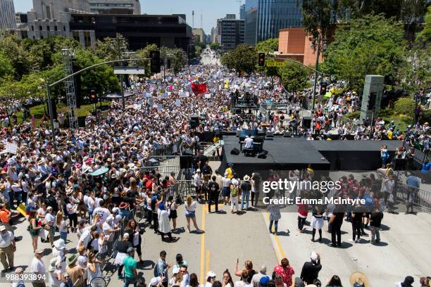 Musician John Legend performs onstage at 'Families Belong Together - Freedom for Immigrants March Los Angeles' at Los Angeles City Hall on June 30,...