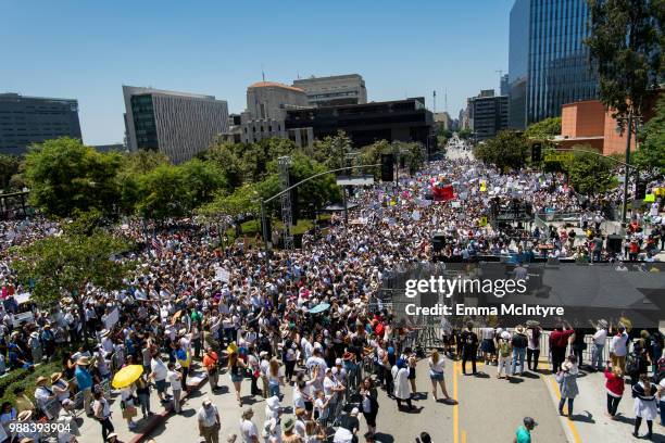 Musician John Legend performs onstage at 'Families Belong Together - Freedom for Immigrants March Los Angeles' at Los Angeles City Hall on June 30,...