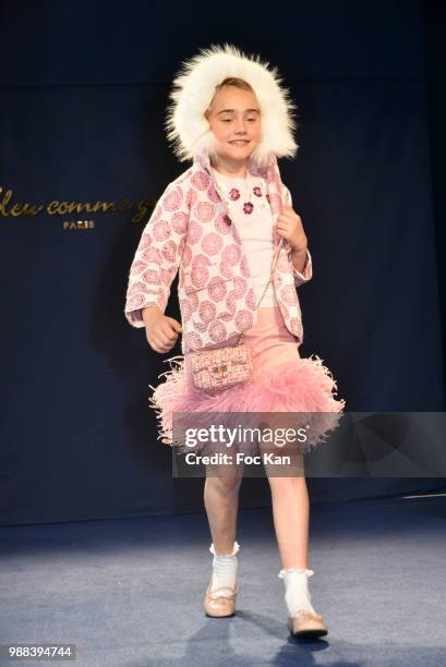 Model walks the runway during the Bleu Comme Gris Childrenswear show At Hotel Ritz on June 30, 2018 in Paris, France.