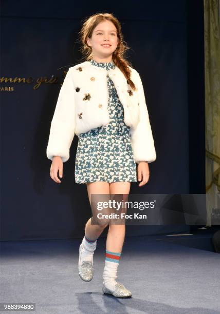 Model walks the runway during the Bleu Comme Gris Childrenswear show At Hotel Ritz on June 30, 2018 in Paris, France.