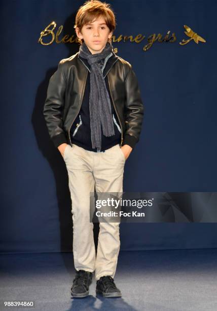 Model walks the runway during the Bleu Comme Gris Childrenswear show At Hotel Ritz on June 30, 2018 in Paris, France.