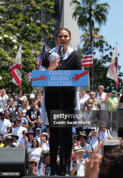 Chrissy Teigen speaks at the Families Belong Together - Freedom For Immigrants March at Los Angeles City Hall on June 30, 2018 in Los Angeles,...