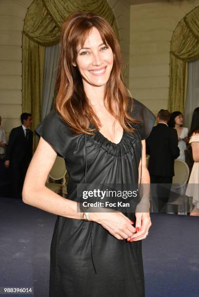 Miss France1999 Mareva Galanter poses during the Bleu Comme Gris Childrenswear show At Hotel Ritz on June 30, 2018 in Paris, France.