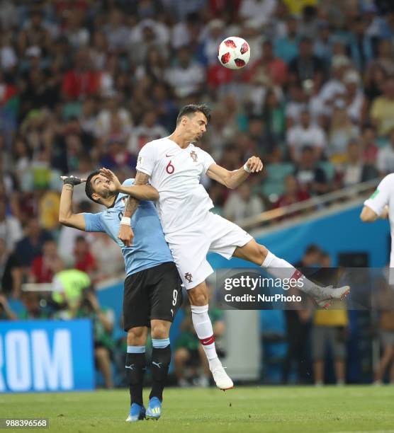 Portugal's Jose Fonte and Uruguays Luis Suarez struggle for a ball during the 2018 FIFA World Cup Russia Round of 16 match between Uruguay and...