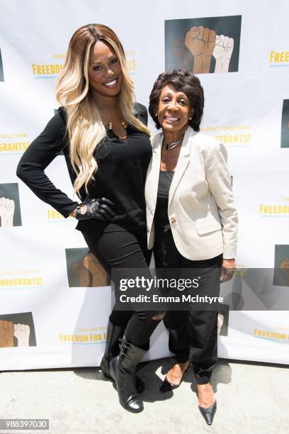 Laverne Cox and Maxine Waters attend 'Families Belong Together - Freedom for Immigrants March Los Angeles' at Los Angeles City Hall on June 30, 2018...