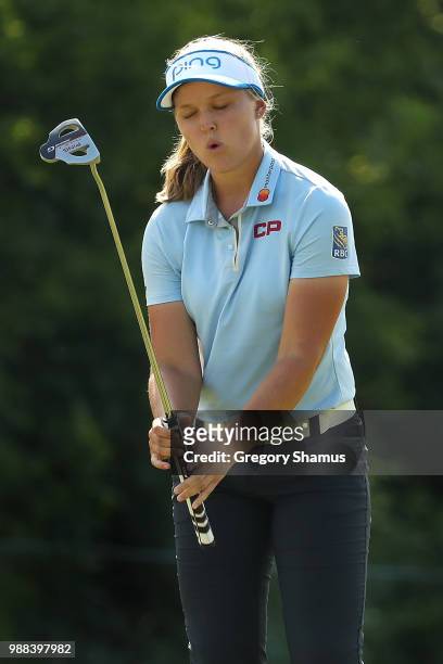 Brooke Henderson reacts to a missed birdie putt on the 15th green during the final round of the 2018 KPMG PGA Championship at Kemper Lakes Golf Club...