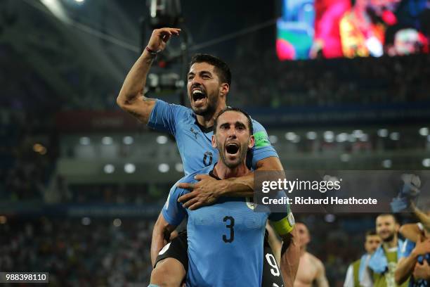 Luis Suarez and Diego Godin of Uruguay celebrate victory at the final whistle during the 2018 FIFA World Cup Russia Round of 16 match between Uruguay...