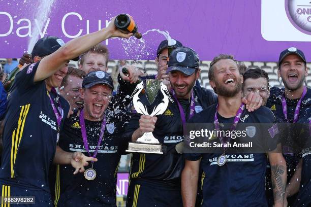 Joe Weatherley pours champagne on to captain James Vince's head as Hampshire celebrate winning the Royal London One-Day trophy at the end of the...