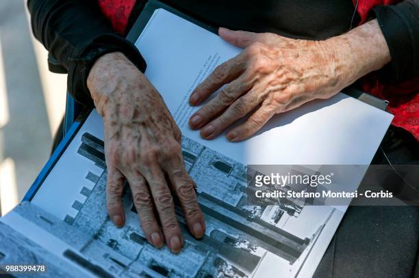 American sculpture Beverly Pepper, 96 years old, shows a book with his works during the presentation of land art projects never realized by the...