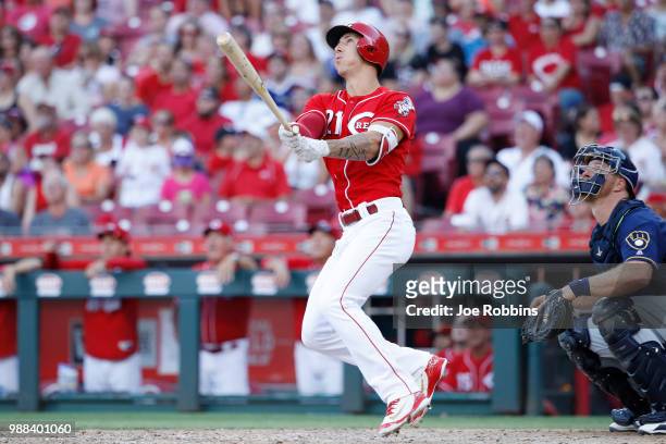 Michael Lorenzen of the Cincinnati Reds hits a grand slam home run while pinch hitting in the seventh inning against the Milwaukee Brewers at Great...