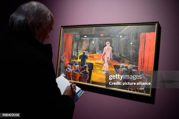 Visitor stands in front of the painting Remember the Promise You Made' during a press preview of the exhibition 'Patrick Angus. Private Show' at the...