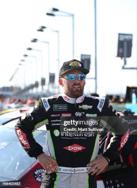 Austin Dillon, driver of the Dow Intellifresh Chevrolet, stands by his car during qualifying for the Monster Energy NASCAR Cup Series Overton's 400...