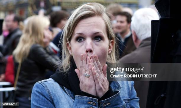 Person attending the Remembrance Day reacts on the Dam in Amsterdam, on May 4, 2010. After a minute silence there was a rumour and people ran away...