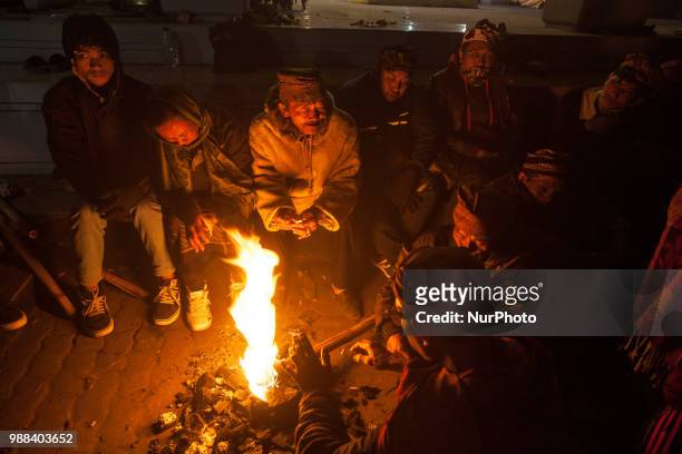 Tenggerese light a fire while waiting for the ceremony of Yadnya Kasada Festival at Mount Bromo, Probolinggo, East Java, on 30th April 2018. The...