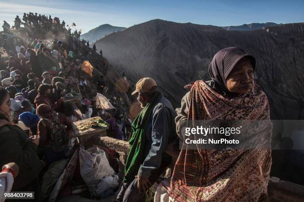 Villagers waiting for Tenggerese sacrifation that thrown to the volcano during Yadnya Kasada Festival at Mount Bromo, Probolinggo, East Java, on 30th...