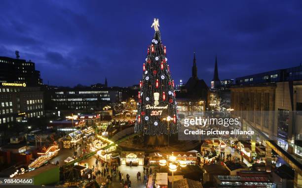 The according to the organisers biggest Christmas tree in the world illuminates the Christmas market in Dortmund, Germany, 30 November 2017. The tree...