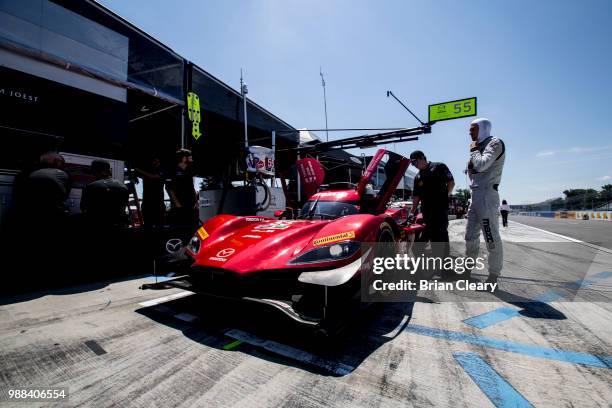 The Mazda DPi of Jonathan Bomarito, Harry Tincknell, of Great Britain, and Spencer Pigot is shown in the pits before qualifying for the Sahlens Six...