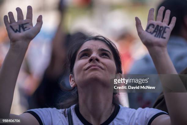 Woman attends a protest outside the Metropolitan Detention Center, after marching to decry Trump administration immigration and refugee policies on...