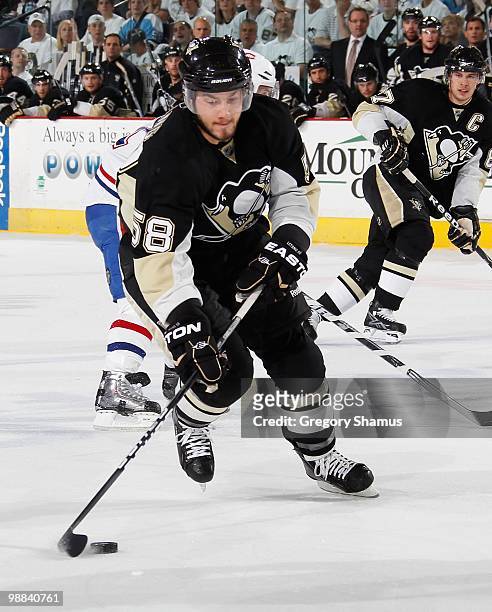 Kris Letang of the Pittsburgh Penguins moves the puck up ice against the Montreal Canadiens in Game One of the Eastern Conference Semifinals during...