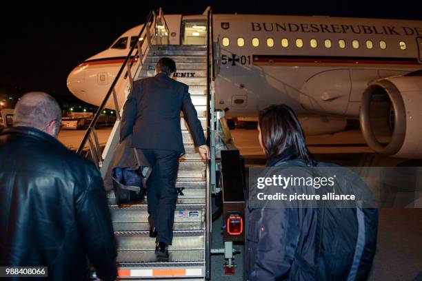 German Minister of Social Affairs Sigmar Gabriel boards the Airbus A319 of the German Air Force at the Dulles International airport in Washington...